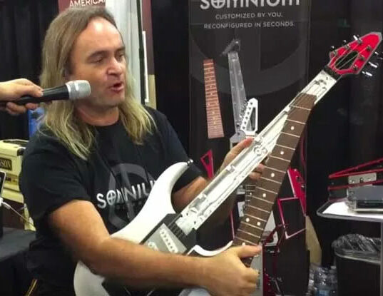 Mark demonstrating guitar neck